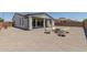Spacious backyard with modern patio furniture and an open seating area, perfect for entertaining at 22853 E Calle Luna --, Queen Creek, AZ 85142