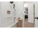 Bright bathroom showcasing a bathtub and an open doorway to another room at 22853 E Calle Luna --, Queen Creek, AZ 85142