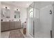 Elegant bathroom featuring double sinks, a glass shower, and a soaking tub at 22853 E Calle Luna --, Queen Creek, AZ 85142