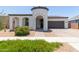 Charming single-Gathering home featuring a barrel tile roof, desert landscaping, and an attached two-car garage at 22853 E Calle Luna --, Queen Creek, AZ 85142