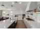 Contemporary kitchen features a large island, white cabinets, and stainless steel appliances at 22853 E Calle Luna --, Queen Creek, AZ 85142
