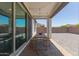 Covered patio features a dining table, string lights, and an open view of the backyard at 22853 E Calle Luna --, Queen Creek, AZ 85142