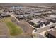 Beautiful birds eye view of a residential neighborhood with walking paths and a community pond at 24847 N 175Th Dr, Surprise, AZ 85387