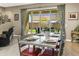 Elegant dining room with seating for eight and views of the backyard at 24847 N 175Th Dr, Surprise, AZ 85387