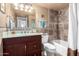 Bathroom featuring a vanity, tiled walls, with a shower and bathtub combination at 2843 E Captain Dreyfus Ave, Phoenix, AZ 85032