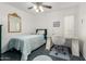 Cozy bedroom with a single bed, bright white walls, and a vanity area at 2843 E Captain Dreyfus Ave, Phoenix, AZ 85032