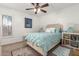 Comfortable bedroom featuring a bed with storage drawers, complemented by a large window at 2843 E Captain Dreyfus Ave, Phoenix, AZ 85032