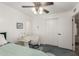 Cozy bedroom featuring a desk, ceiling fan and closet for efficient space saving and comfort at 2843 E Captain Dreyfus Ave, Phoenix, AZ 85032