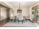Bright dining area with table, chairs, and view to outdoor patio at 2843 E Captain Dreyfus Ave, Phoenix, AZ 85032