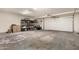 Spacious garage with a door and ample space for storage, and with an interesting painted floor at 2843 E Captain Dreyfus Ave, Phoenix, AZ 85032
