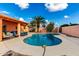 Serene backyard pool surrounded by lush greenery and a comfortable patio area for ultimate relaxation at 2843 E Captain Dreyfus Ave, Phoenix, AZ 85032