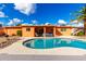 Sparkling backyard pool with a covered patio, designed for relaxation and fun in the sun at 2843 E Captain Dreyfus Ave, Phoenix, AZ 85032