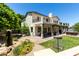 Back of house with patio, balcony, disc golf, and landscaped backyard at 3229 E Mountain Village Cir, Phoenix, AZ 85042
