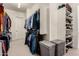 Walk-in closet with custom shelving, hanging rods, and storage baskets providing ample space for clothing and accessories at 3229 E Mountain Village Cir, Phoenix, AZ 85042