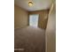 Bedroom featuring neutral carpet, a sliding glass door with vertical blinds, and a flush mount light at 3434 E Baseline Rd # 204, Phoenix, AZ 85042