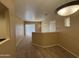 Spacious living area featuring neutral carpeting, lighting, and a sliding door at 3434 E Baseline Rd # 204, Phoenix, AZ 85042