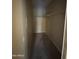 An empty walk-in closet with carpet and hanging storage at 3434 E Baseline Rd # 204, Phoenix, AZ 85042