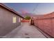 Backyard featuring covered patio with wood beams and concrete floor, ideal for outdoor projects and a great workshop area at 3513 W Maryland Ave, Phoenix, AZ 85019