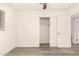 Bedroom with vinyl floors, closet, and doors to other rooms at 3513 W Maryland Ave, Phoenix, AZ 85019