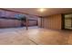 Spacious covered carport featuring concrete flooring and access to storage space, ideal for parking and outdoor projects at 3513 W Maryland Ave, Phoenix, AZ 85019