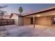 Covered carport featuring wood support beams, concrete flooring, and access to storage, perfect for parking and activities at 3513 W Maryland Ave, Phoenix, AZ 85019