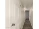 Hallway featuring wood-look floors, clean white walls, and modern lighting at 3513 W Maryland Ave, Phoenix, AZ 85019