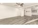 Expansive living area with hard surface floors, fresh paint, and plenty of space for entertaining or relaxing at 3513 W Maryland Ave, Phoenix, AZ 85019