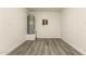 The utility room features neutral colors, wood-look floors, and a window at 3513 W Maryland Ave, Phoenix, AZ 85019