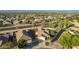Aerial view of a well-maintained single-Gathering home with desert landscaping, nestled in a vibrant, green neighborhood at 3532 W Mesquite Ave, San Tan Valley, AZ 85144