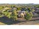 Aerial view of a home with desert landscaping, privacy walls, and mountains in the distance at 3532 W Mesquite Ave, San Tan Valley, AZ 85144