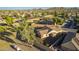 Aerial view of a home with desert landscaping, privacy walls, and a nearby mountain at 3532 W Mesquite Ave, San Tan Valley, AZ 85144