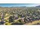 Aerial view of a well-maintained single-Gathering home with desert landscaping, nestled in a vibrant, green neighborhood at 3532 W Mesquite Ave, San Tan Valley, AZ 85144