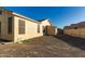 Backyard featuring desert landscaping, storage shed, and block wall at 3532 W Mesquite Ave, San Tan Valley, AZ 85144