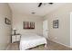 Bedroom with carpet floors, neutral paint, ceiling fan, bed and nightstand at 3532 W Mesquite Ave, San Tan Valley, AZ 85144