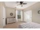 Bedroom featuring carpet floors, neutral paint, ceiling fan, dresser and ample closet space at 3532 W Mesquite Ave, San Tan Valley, AZ 85144