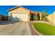 Charming single-story home featuring a two-car garage and desert landscaping at 3532 W Mesquite Ave, San Tan Valley, AZ 85144