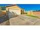 Welcoming home featuring low-maintenance landscaping and attached two-car garage at 3532 W Mesquite Ave, San Tan Valley, AZ 85144