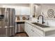 Bright kitchen with stainless steel appliances, white cabinetry, and granite countertops at 3532 W Mesquite Ave, San Tan Valley, AZ 85144