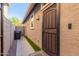 A side exterior view shows the side door and a fenced walkway at 4152 W Bradshaw Creek Ln, New River, AZ 85087