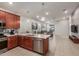 Open kitchen with stainless steel appliances and views into the living area at 4152 W Bradshaw Creek Ln, New River, AZ 85087