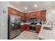 Well-equipped kitchen with stainless appliances, tiled backsplash, and ample counter space at 4152 W Bradshaw Creek Ln, New River, AZ 85087