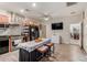 Spacious kitchen with stainless steel appliances, island, and access to an adjacent dining area at 4152 W Bradshaw Creek Ln, New River, AZ 85087
