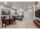 Bright living area featuring tile floors, a dining table, and comfortable seating at 4152 W Bradshaw Creek Ln, New River, AZ 85087