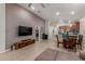 Open-concept living area featuring high ceilings, a ceiling fan, and tile floors at 4152 W Bradshaw Creek Ln, New River, AZ 85087