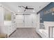 Spacious Bedroom with a barn door, white dresser, and comfortable crib for a serene setting at 4238 E Mitchell Dr, Phoenix, AZ 85018