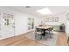 Bright dining room featuring a skylight, modern lighting, and a stylish dining set at 4238 E Mitchell Dr, Phoenix, AZ 85018