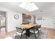 Well-lit dining space with a skylight, unique light fixture, and open design at 4238 E Mitchell Dr, Phoenix, AZ 85018