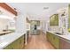 Spacious kitchen featuring stainless steel appliances, ample counter space, and wood flooring at 4238 E Mitchell Dr, Phoenix, AZ 85018