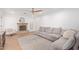 Cozy living room featuring a decorative fireplace, ceiling fan, and lots of natural light at 4238 E Mitchell Dr, Phoenix, AZ 85018