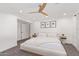 Bright main bedroom with neutral decor, a ceiling fan, and modern recessed lighting at 4238 E Mitchell Dr, Phoenix, AZ 85018